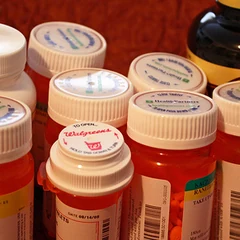 Orange pill bottles with white caps