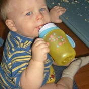 baby drinking from a bottle