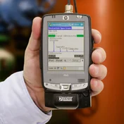 hand holding a handheld computer